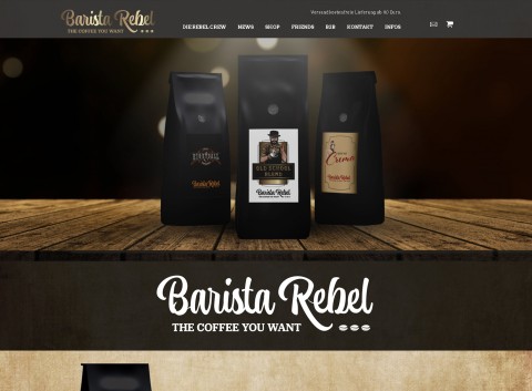 Startseite der von Wrocklage Werbewerkstatt umgesetzten Barista Rebel‑Website mit drei Kaffeepackungen auf Holz und Logo ‘THE COFFEE YOU WANT’